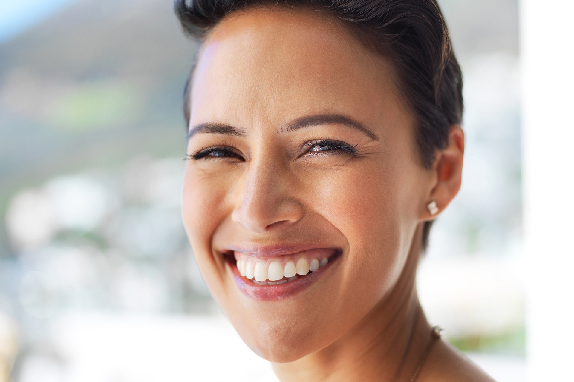 Smiling patient restored cavity-damaged tooth with dental fillings at Bloom Family Dental in Sheboygan, Wisconsin.